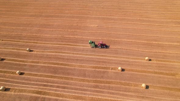 Agricultural Concept Machine Collect Straw in the Field and Make Large Bales