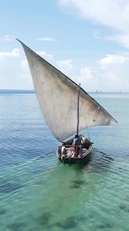 Vertical Video Boats in the Ocean Near the Coast of Zanzibar Tanzania