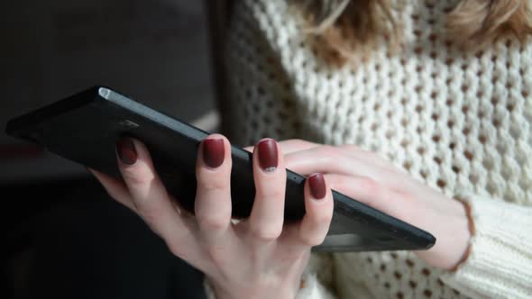 Professional Woman Using Digital Tablet Touchscreen Device At Desk