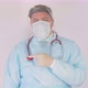 Doctor finger pointing in a white coat personal protective equipment and mask Due Coronavirus Covid - VideoHive Item for Sale