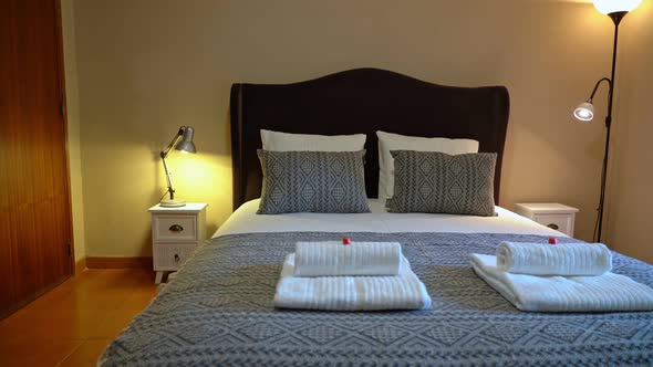 Zoom in on Pillows Placed on Bed in a Naturally Well Lit and Tidy Modern Bedroom