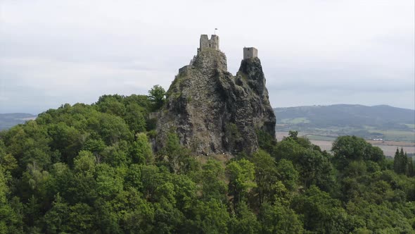 Ruins of the Trosky castle on a rocky outcrop amongst trees,Czechia.