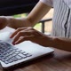 Close up of woman's hands typing on laptop.  - VideoHive Item for Sale