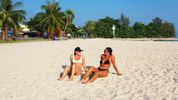 Beautiful ladies tan on paradise bay beach time by blue lagoon with white sand background of Thailan