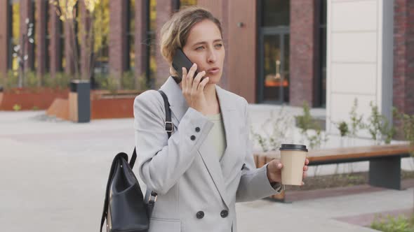 Businesswoman Having Phone Conversation Outdoors