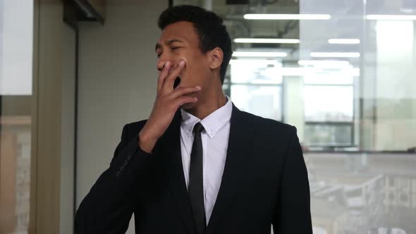 Yawning Tired Black Businessman in Suit, Indoor