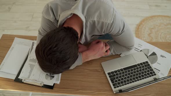 Businessman Tired Overworked He Sleeping Over a Laptop Computer on the Desk