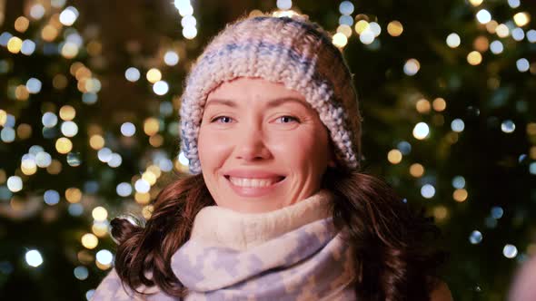 Happy Woman with Sparklers on Christmas in City