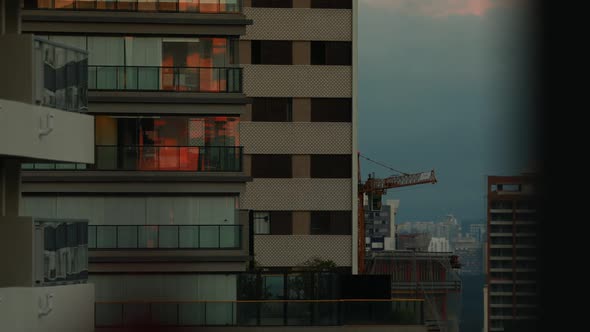 Afternoon sunset reflection to night timelapse in a big town