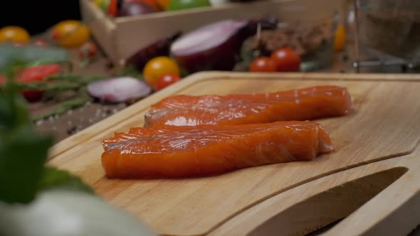 Two Slices of Salmon on the Cutting Board