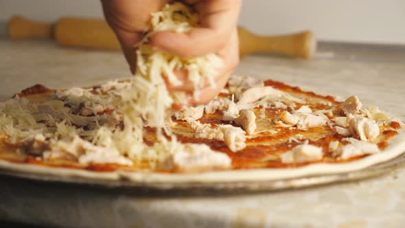 Male Hands of Cook Putting Grated Cheese on Pastry with Ingredients in Metal Form at Cuisine