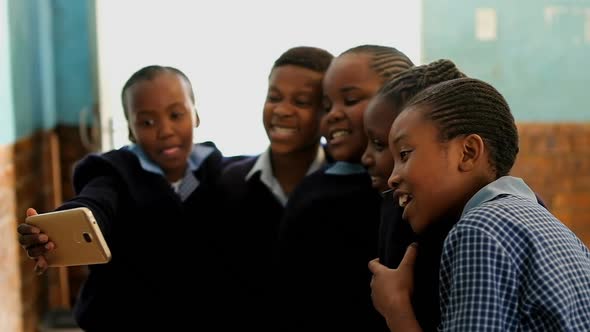 Schoolkids taking selfie in the classroom 4k