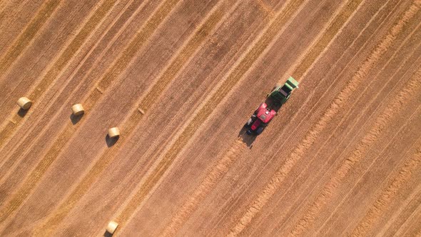 Top View Tractor Machine Collect Straw in the Agricultural Field Quality