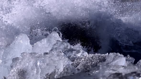 Ice From a Glacier Washing By Atlantic Ocean Waves on a Black Diamond Beach in Iceland