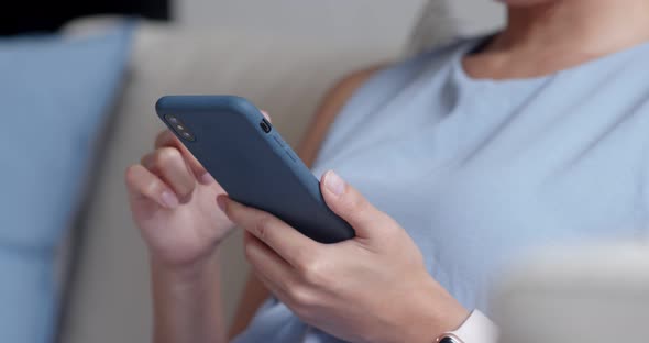 Woman Use of Mobile Phone at Home