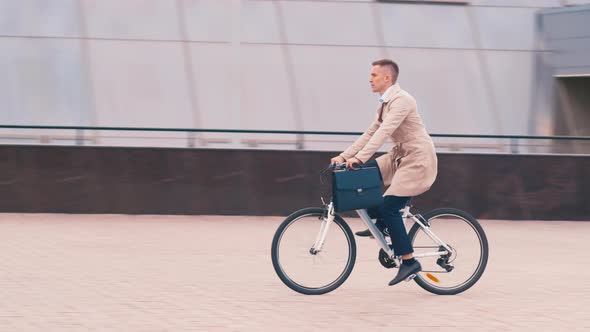 Businessman riding a bike