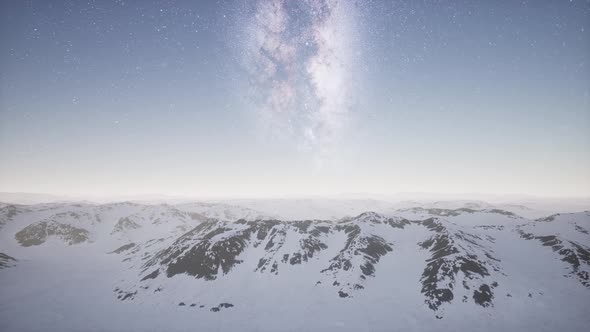 Milky Way Above Snow Covered Terrain alt