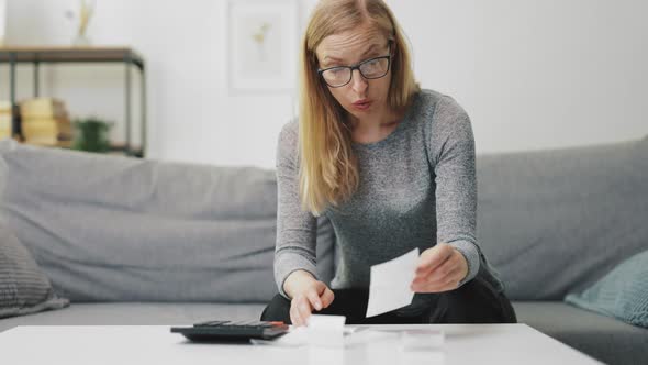 Stressed Couple Calculating Bills