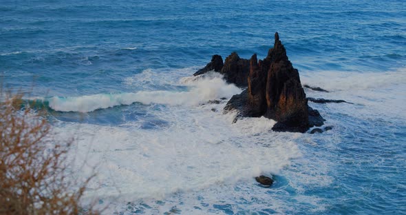 Big Waves Crash Into the Black Volcanic Rocks on the Remote Shore of Tenerife Island