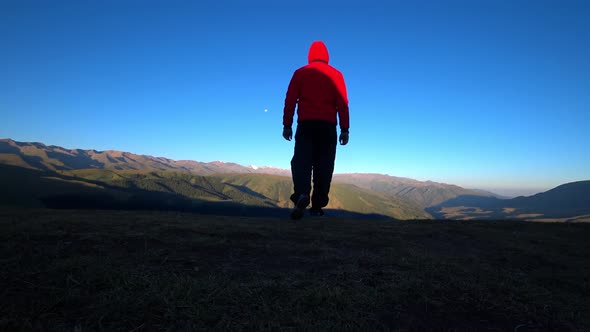 The Guy Goes to the Edge of Hill and Admires View