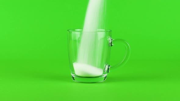 Pour Sugar Mug Glass Thick Bottom Green Contrasting Background. Concept