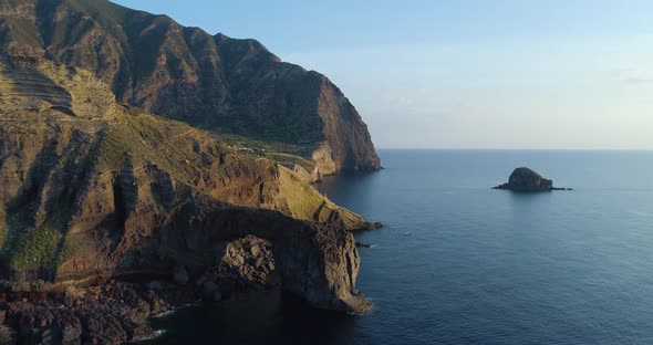 Aerial View of Salina Coast Deep Cliff Little Village in a Summer Sunset