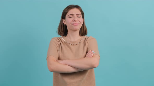 A Displeased Young Woman Is Crossing Hands and Feeling Offended.