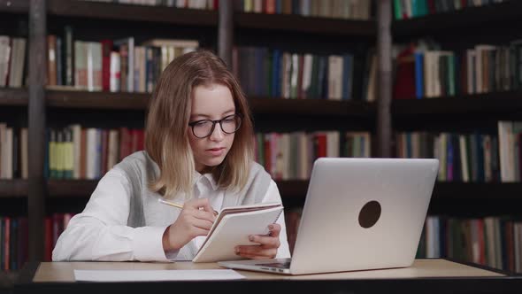 Caucasian Young Girl Wearing Glasses Doing Homework Schoolgirl Studying Online Using Laptop Making