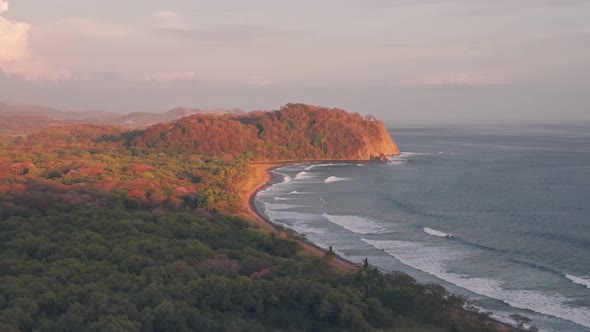 Playa Buena Vista Beach and rainforest at sunset, Guanacaste Province, Costa Rica. Aerial drone view