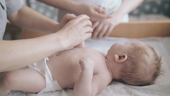 Professional Nurse Hands Practice Infant Hypertonus Massage
