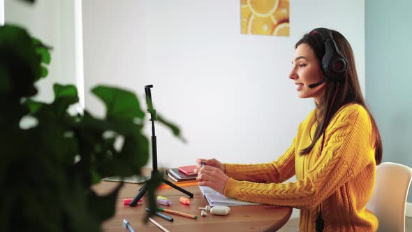 Girl Student Talking Online Via Webcam Using Video Call with Teacher