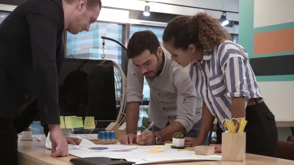 Creative Business People Group Having Conversation at Office Desk in Workplace