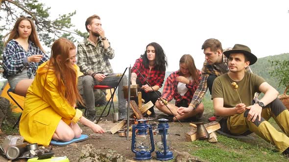 Young Hikers Spending Time in the Camp, Preparing Food, Weekend with Friends.