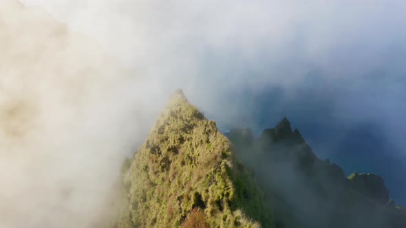 Na Pali Coast State Park, Thick White Cloud Surrounds Sharp Hawaiian Mountain Top