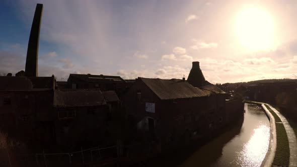 Aerial footage of an old abandoned, derelict pottery factory and bottle kiln located in Longport, St