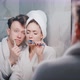 a Young Married Couple Brushing Their Teeth Together - VideoHive Item for Sale