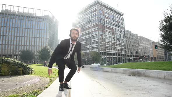 Slow motion young business bearded man jumping outdoor