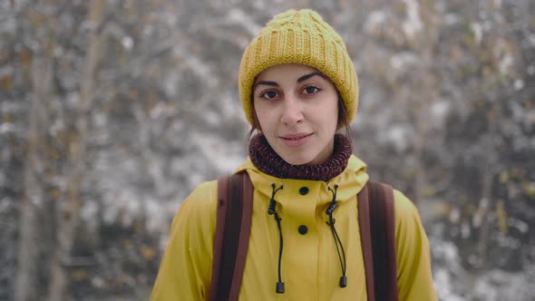 Travel Woman Hiking in the Wild Frosty Forest Covered Snow