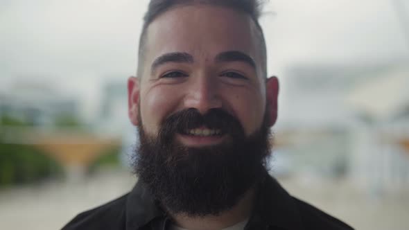 Closeup Shot of Smiling Bearded Male Face.
