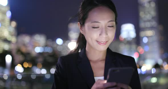 Young woman use of mobile phone in city