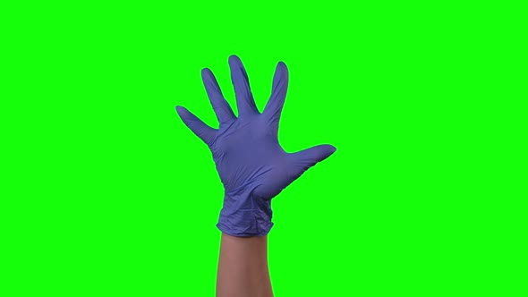 Doctors Female Hand in Blue Glove Is Swearing and Gestures Nervously at Green Screen
