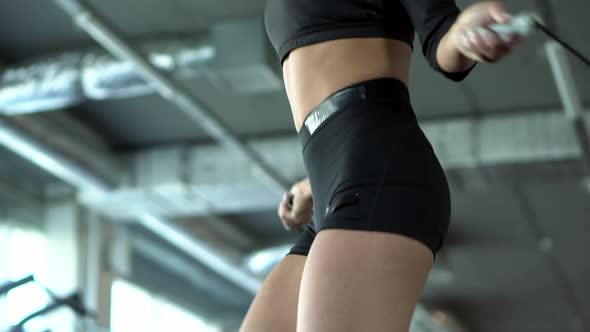 Young Woman Jumping Rope in Gym, Slow Motion