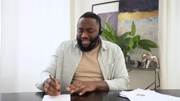 Confident African American Man with Headphones Business Leader Company Employee Having Online