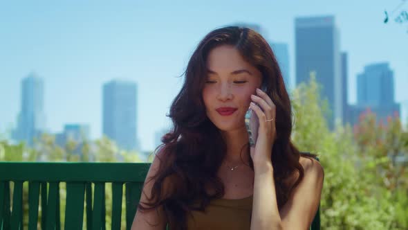 Happy Woman Calling Phone in Park Close Up