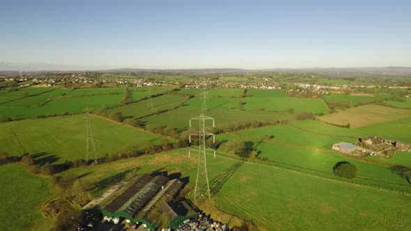 Aerial footage of  high voltage electricity towers and power lines in the beautiful Staffordshire co