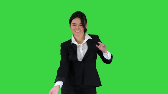 Beautiful Businesswoman Inviting You To Dance with Her on a Green Screen, Chroma Key