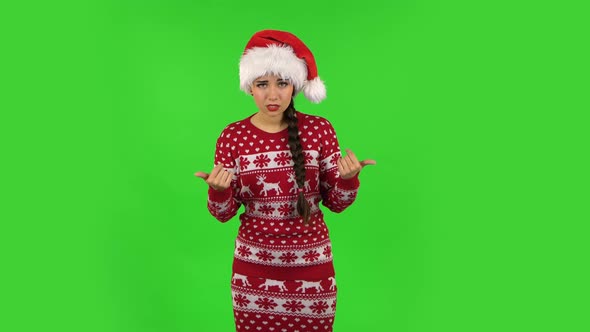 Sweety Girl in Santa Claus Hat Is Showing Gesture Come Here. Green Screen