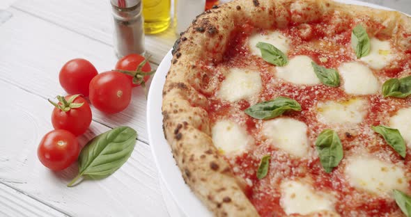 Italian Pizza with Mozzarella Cheese Basil and Cherry Tomatoes