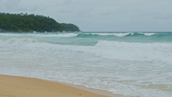 A Huge Wave Crashed Towards The Shore.