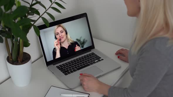 Woman Working From Home Having Group Videoconference On Laptop